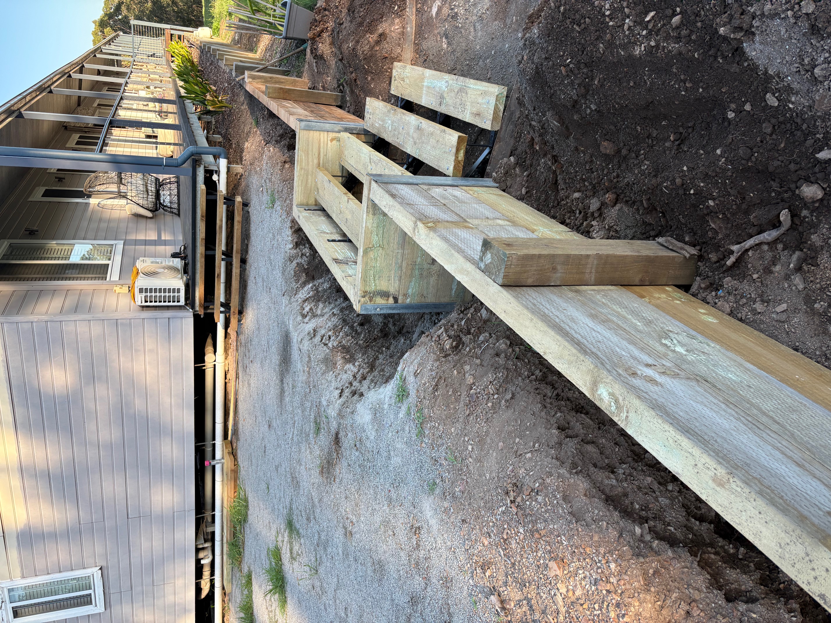 newly built wooden stairs and retaining wall